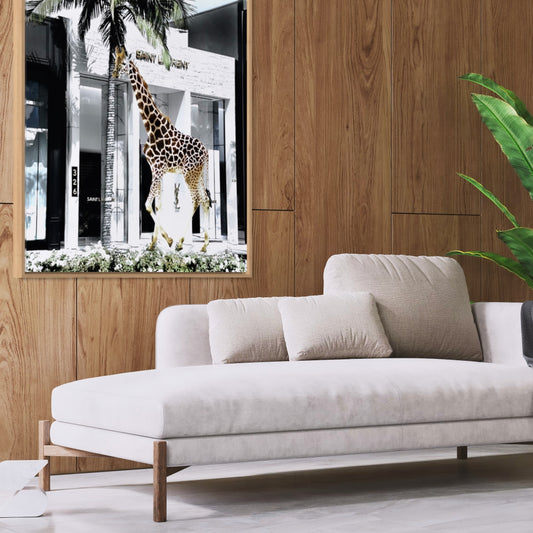 High Rise giraffe and palm tree wall art framed above a green velvet chair