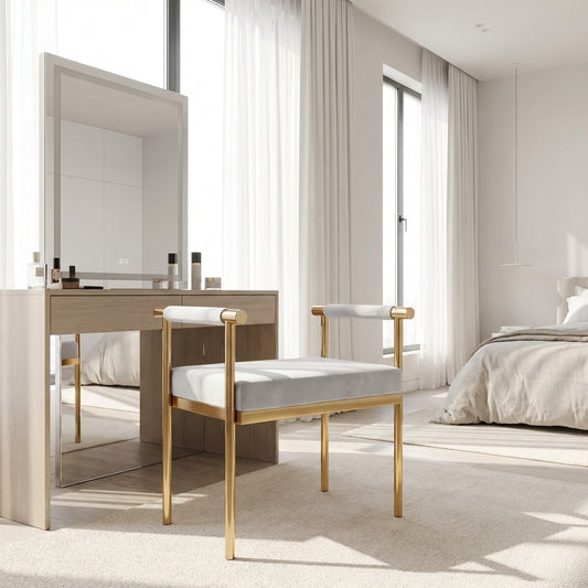 Modern bedroom with a vanity table, bench, and bed.