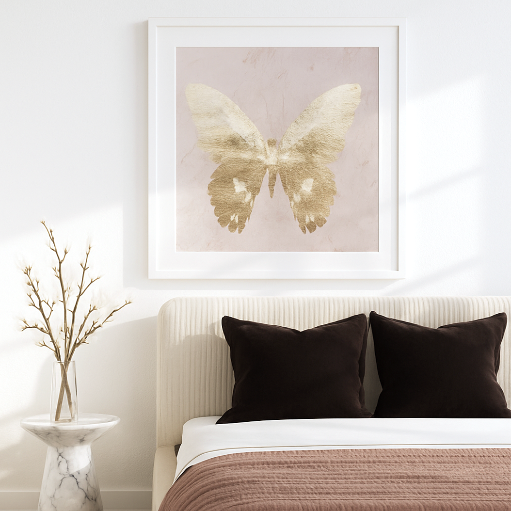 Golden Glimmer single gold butterfly with outstretched wings on a soft cream-pink ground wall art