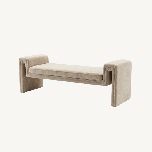Solace textured bench in natural taupe, waterfall silhouette with upholstered arms styled at the end of a bed on a zebra print rug