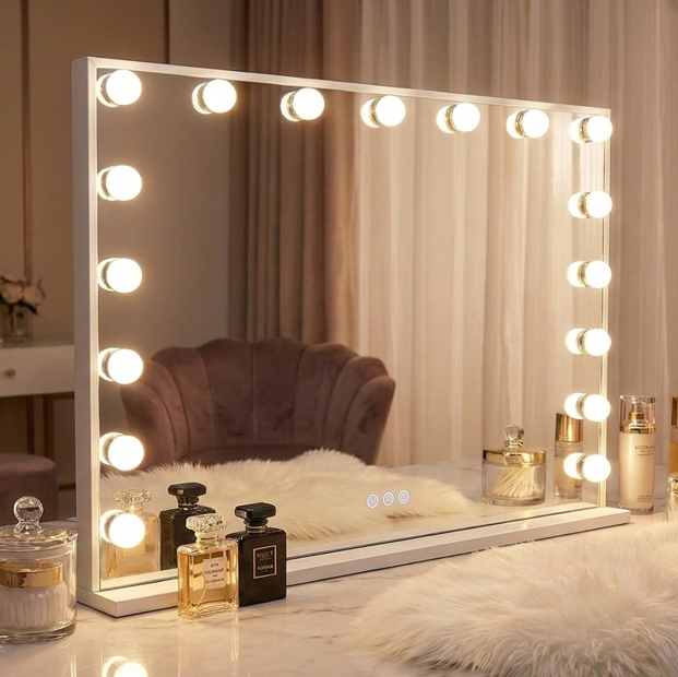 Makeup mirror with lights on a vanity table with perfumes