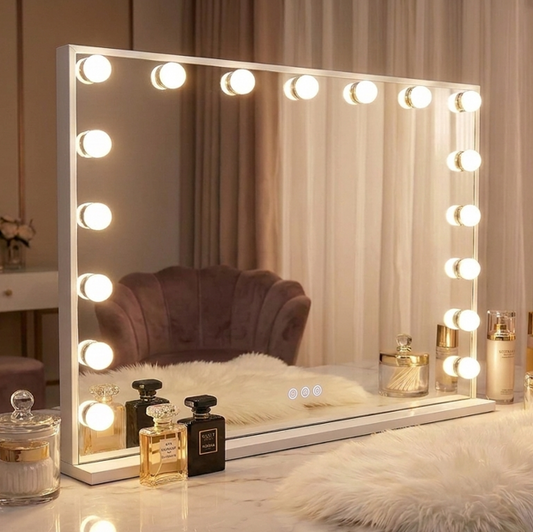 Makeup mirror with lights on a vanity table with perfumes