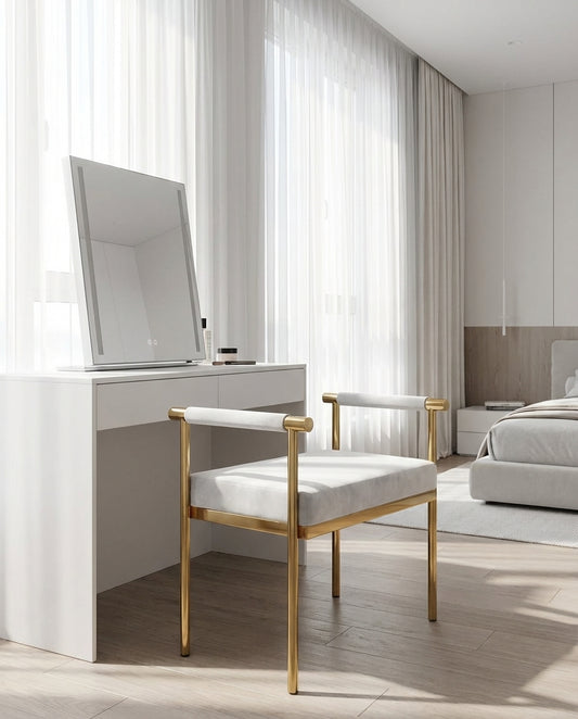 Modern bedroom with a vanity table and chair, large mirror, and bed.