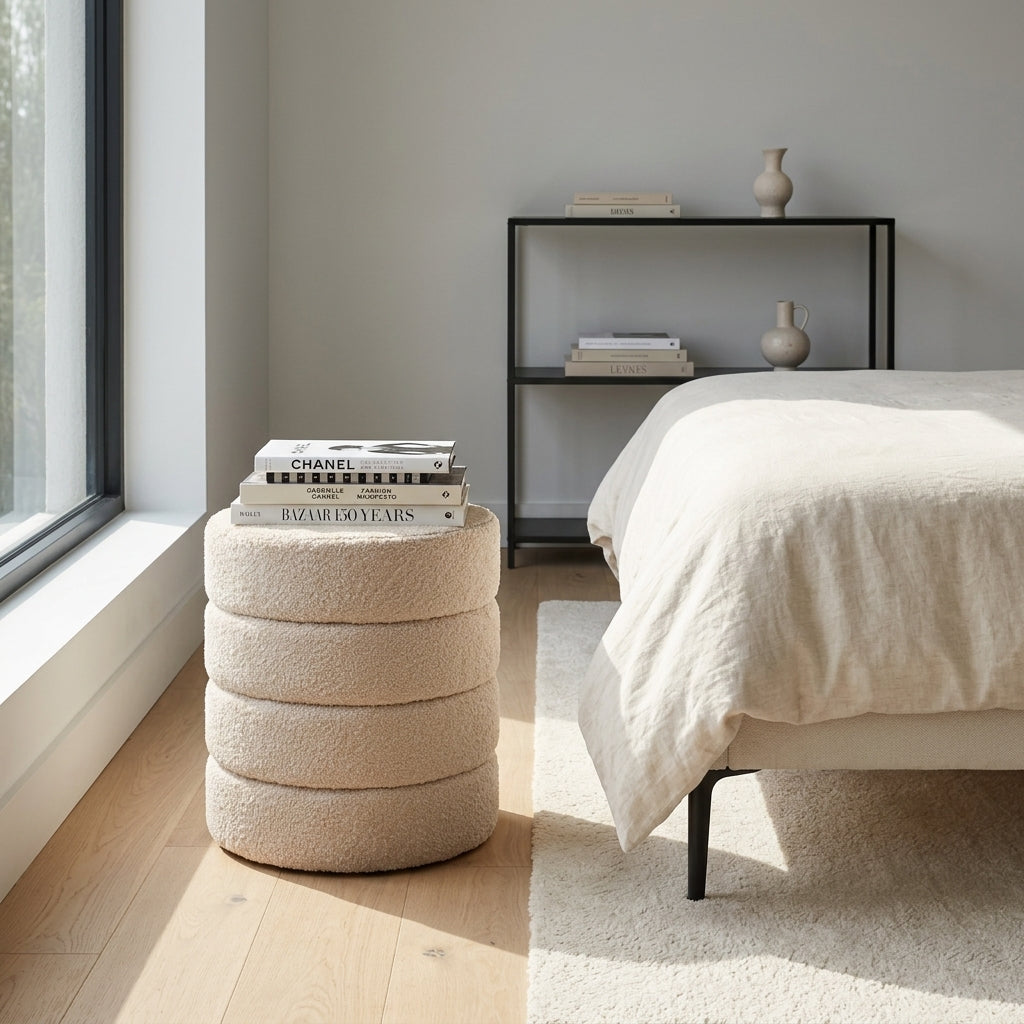 Cleo nude boucle ottoman front view showing stacked ring sculptural silhouette on white background
