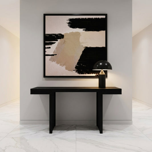 Modern interior with a black console table and abstract art on a gray wall.