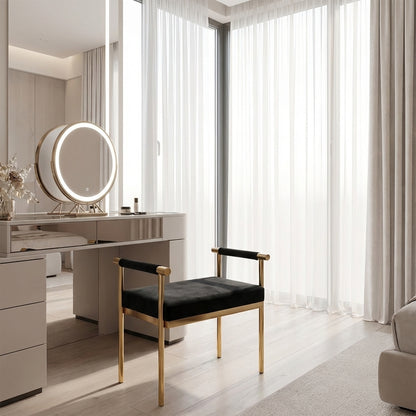 Modern vanity setup with a round mirror and bench in a bright room.