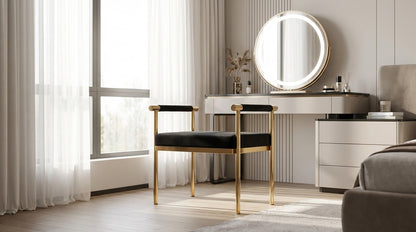Modern bedroom with a vanity table, round mirror, and chair.