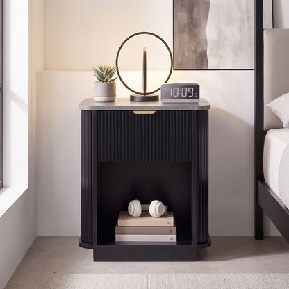 Tura black fluted bedside table with marble-effect top, styled with a round LED lamp, succulent, alarm clock and headphones in a contemporary bedroom