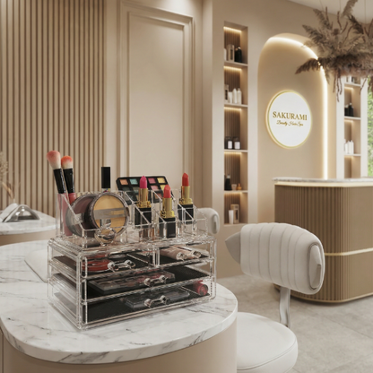 Clear acrylic cosmetic organizer with makeup items on a desk.