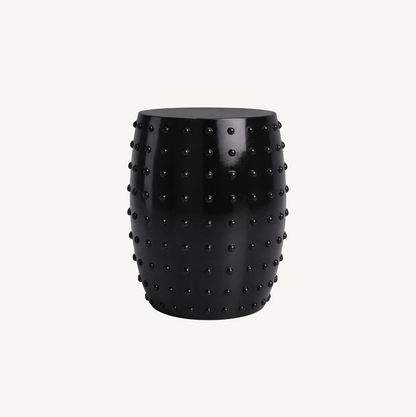 Atelier Noir black studded side table, white background product shot showing barrel form with all-over raised circular studs
