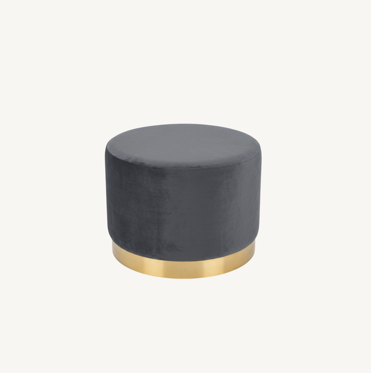 Monaco round ottoman in ocean grey-blue velvet with brushed gold base, styled beside a round gold glass coffee table on a jute rug