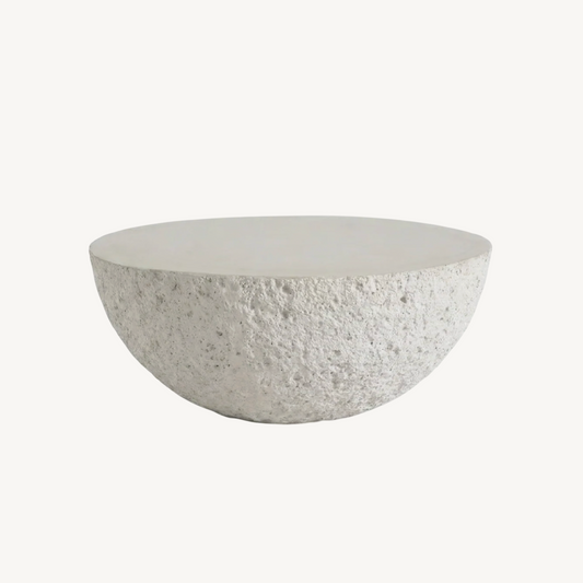 Lunar fossil stone coffee table, white background product shot showing half-dome silhouette with raw hand-textured stone finish
