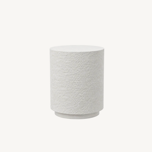 Muse fossil textured side table, white background product shot showing cylindrical form with organic fossil stone finish