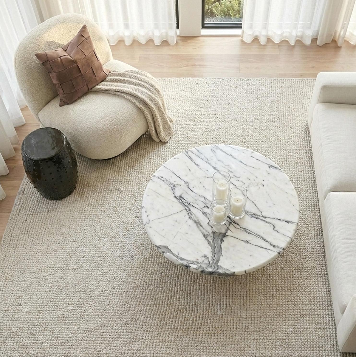 Nobu round sculptural stone coffee table in panda marble with bold black and white veining