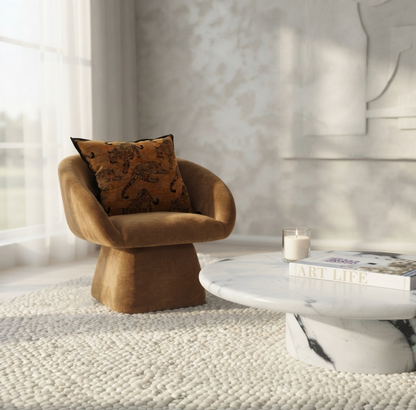 Nobu panda marble coffee table styled in a warm living room with a brown accent chair and neutral textured rug